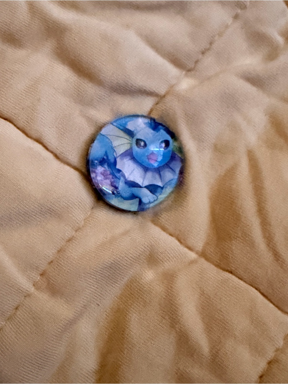 Pokemon Beige Puffer Jacket with Blue Vaporeon Button